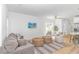 Comfortable living space with a plush sofa, stylish seating, and views into the kitchen and dining areas at 210 26Th Ave. S, Myrtle Beach, SC 29577