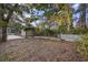 Large backyard with mature trees and a wooden fence at 4502 Eyerly St., North Myrtle Beach, SC 29582