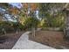 Peaceful backyard with a stone pathway and arbor at 4502 Eyerly St., North Myrtle Beach, SC 29582