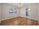 Simple bedroom with laminate wood floor and access to bathroom at 4502 Eyerly St., North Myrtle Beach, SC 29582