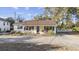 Quaint yellow cottage with blue shutters and welcoming porch at 4502 Eyerly St., North Myrtle Beach, SC 29582