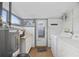 Bright laundry room, washer, dryer, storage cabinets and exterior access at 4502 Eyerly St., North Myrtle Beach, SC 29582