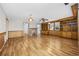 Bright living room with hardwood floors, built-in shelving, and a brick fireplace at 4502 Eyerly St., North Myrtle Beach, SC 29582