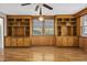 Living room with hardwood floors, built-in shelving and a ceiling fan at 4502 Eyerly St., North Myrtle Beach, SC 29582