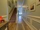 Light-filled entryway, showcasing a staircase and hardwood floors at 5910 Lazio Ct. # 5910, Myrtle Beach, SC 29579