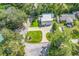 Bird's eye view showcases lush landscaping, circular drive, and metal roof of this beautiful property at 613 Lee Ave., Murrells Inlet, SC 29576