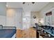 Long hallway with hardwood floors, wainscoting, foosball table, and desk area at 613 Lee Ave., Murrells Inlet, SC 29576