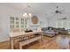 Open-concept living space with hardwood floors, a sectional, and a dining room at 613 Lee Ave., Murrells Inlet, SC 29576