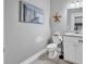Tastefully decorated powder room with a modern vanity, granite countertop, and coastal decor at 613 Lee Ave., Murrells Inlet, SC 29576