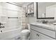 This full bathroom has granite countertops, storage cabinets, and a shower with tub at 7246 Sarteano Dr., Myrtle Beach, SC 29572