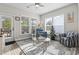 Bright sunroom featuring comfortable seating, neutral walls, and multiple windows providing an abundance of natural light at 7246 Sarteano Dr., Myrtle Beach, SC 29572