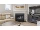 Cozy living room featuring a fireplace with a dark mantel, creating a warm and inviting atmosphere at 7246 Sarteano Dr., Myrtle Beach, SC 29572