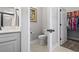 Stylish powder room featuring a modern vanity, toilet, and linen closet with a well-organized wardrobe at 7246 Sarteano Dr., Myrtle Beach, SC 29572