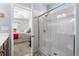 Bathroom with large glass shower, tiled walls, and access to bedroom at 1004 Millsite Dr., Conway, SC 29526