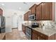 Modern kitchen with granite countertops, stainless steel appliances, and ample cabinet space at 1004 Millsite Dr., Conway, SC 29526