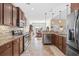 Open concept kitchen with granite countertops, stainless steel appliances, and views into the dining area at 1004 Millsite Dr., Conway, SC 29526