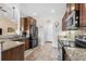 Well-equipped kitchen with stainless steel appliances, granite countertops, and wooden cabinetry at 1004 Millsite Dr., Conway, SC 29526