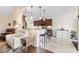 Modern kitchen with dark wood cabinets, pendant lighting, and a breakfast bar connecting to the living room at 1004 Millsite Dr., Conway, SC 29526