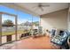 Inviting screened porch featuring ceiling fan and comfortable seating with views of the fenced backyard at 1004 Millsite Dr., Conway, SC 29526