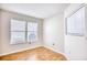 Well-lit bedroom with two windows and hardwood floors at 121 Whitehaven Ct., Myrtle Beach, SC 29577