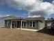 Spacious backyard with a covered patio, perfect for outdoor entertaining at 1240 Winding Creek Way, Myrtle Beach, SC 29588