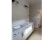 Elegant bathroom with double sinks, quartz countertops, and modern lighting at 1240 Winding Creek Way, Myrtle Beach, SC 29588