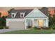 Charming two-story home with a covered porch and attached garage at 1240 Winding Creek Way, Myrtle Beach, SC 29588