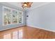 Bright bedroom with hardwood floors, ceiling fan, and large windows at 126 Pickering Dr., Murrells Inlet, SC 29576