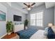 Tastefully decorated main bedroom features hardwood floors, ceiling fan, and stylish furnishings at 126 Pickering Dr., Murrells Inlet, SC 29576