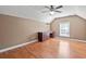 Bright bonus room features a built-in desk, ceiling fan and beautiful hardwood floors at 126 Pickering Dr., Murrells Inlet, SC 29576