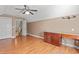Bonus room features a built-in desk, ceiling fan and beautiful hardwood floors at 126 Pickering Dr., Murrells Inlet, SC 29576