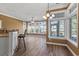 Bright dining area featuring large windows, hardwood floors, and a ceiling fan at 126 Pickering Dr., Murrells Inlet, SC 29576
