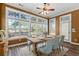 Dining room with large windows, wood table, seating for six, and decorative rug at 126 Pickering Dr., Murrells Inlet, SC 29576