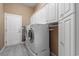 Bright laundry room with washer, dryer and storage at 126 Pickering Dr., Murrells Inlet, SC 29576