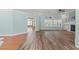 Open living area featuring hardwood floors, a fireplace, and plenty of natural light at 126 Pickering Dr., Murrells Inlet, SC 29576