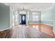 Bright and spacious living room with high ceilings, large windows, and stylish flooring at 126 Pickering Dr., Murrells Inlet, SC 29576
