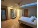 Bright bedroom featuring a skylight, ensuite bathroom, and outside deck access at 187 Alston Rd., Pawleys Island, SC 29585
