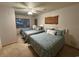 This cozy bedroom features three beds, ceiling fan and natural light at 187 Alston Rd., Pawleys Island, SC 29585