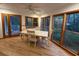 Bright dining area with views of the natural surroundings with access to the back porch at 187 Alston Rd., Pawleys Island, SC 29585