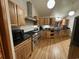 Spacious kitchen with stainless steel appliances, granite countertops, and custom wood cabinetry at 187 Alston Rd., Pawleys Island, SC 29585