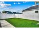 Backyard with a well-maintained lawn and a privacy fence at 2023 Singing Palm Loop, Little River, SC 29566