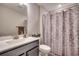 Bathroom with a vanity, a white toilet, and a patterned shower curtain at 2023 Singing Palm Loop, Little River, SC 29566