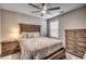 Well-lit bedroom featuring a ceiling fan, wooden furniture, and a comfortable bed at 2023 Singing Palm Loop, Little River, SC 29566