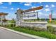 Community entrance sign: Bridgewater, with stone pillar, lush landscaping, and blue skies at 2023 Singing Palm Loop, Little River, SC 29566