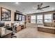 Finished game room with ceiling fan, carpet flooring, lots of light, and plenty of room to play at 2023 Singing Palm Loop, Little River, SC 29566