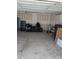 Spacious garage featuring a motorcycle, ample storage, and room for projects at 2023 Singing Palm Loop, Little River, SC 29566