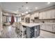 Modern kitchen featuring a large island with seating, stainless steel appliances, and designer tile backsplash at 2023 Singing Palm Loop, Little River, SC 29566