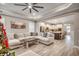 Open floor plan showing the living room connected to the kitchen with a view of the breakfast bar seating at 2023 Singing Palm Loop, Little River, SC 29566