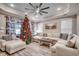 Bright living room features crown molding, a ceiling fan, recessed lights, and a comfortable sectional sofa at 2023 Singing Palm Loop, Little River, SC 29566