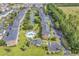 Aerial view of community with pool, pond, and parking at 3943 Gladiola Ct. # 204, Myrtle Beach, SC 29588